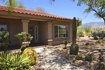 Sun City home for sale with meticulous landscaping and mountain views